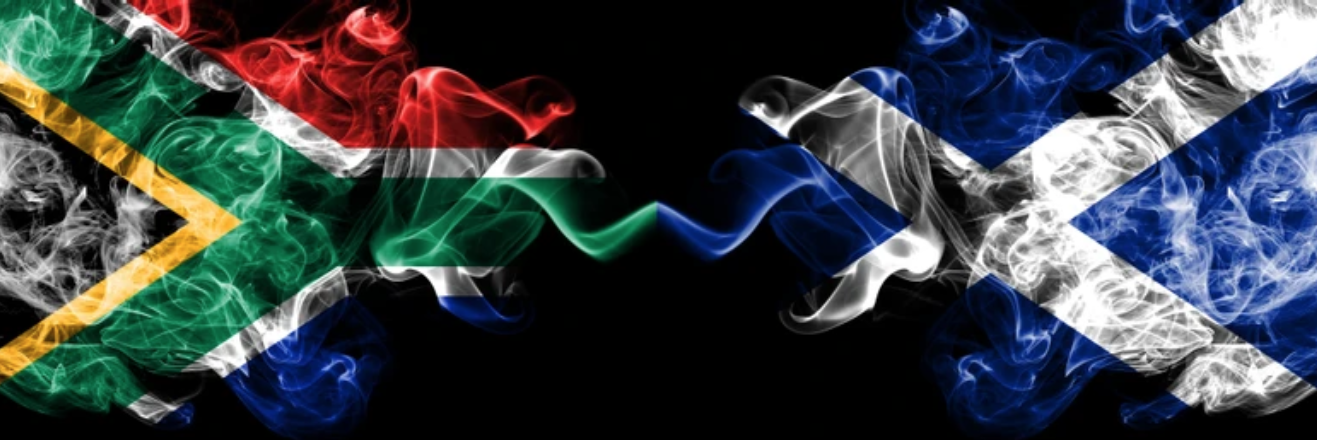 South Africa and Scotland flags in smoke